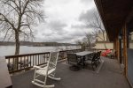 TOP DECK WITH DINING TABLE AND GREAT VIEWS OF THE LAKE